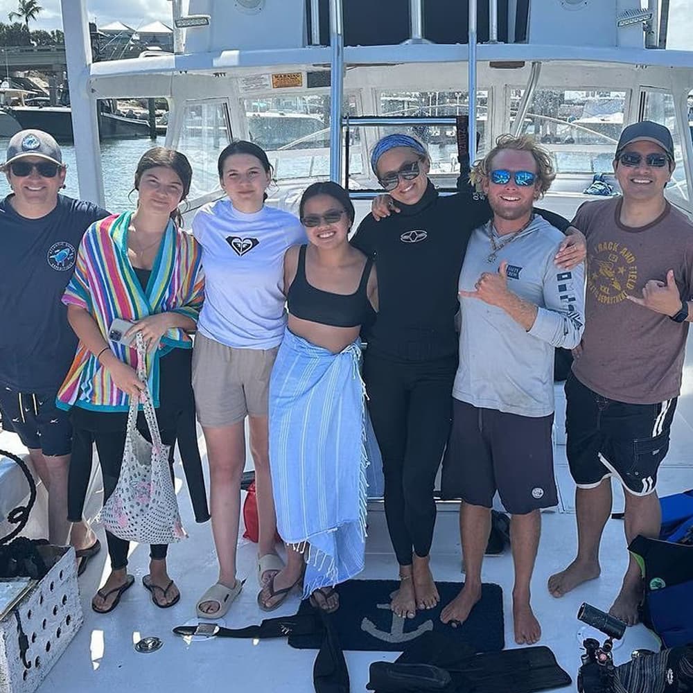 An image of a group of guests on a West Florida Shark Diving shark excursion at the dock. 